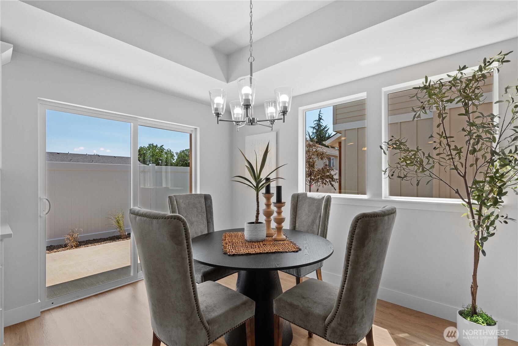 1030 Finch Lane, Unit H1 Wenatchee, WA 98801 - Photo 15 of 30 a view of a dining room with furniture and chandelier