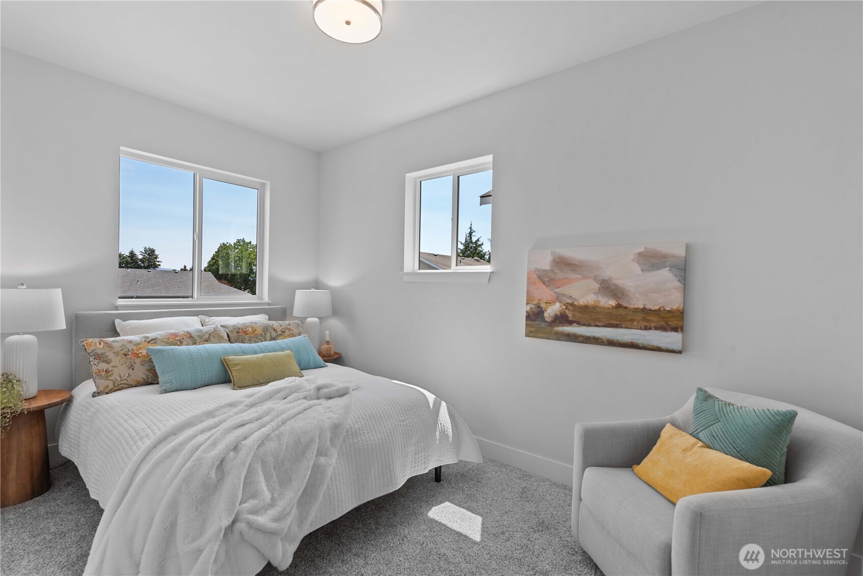 1030 Finch Lane, Unit H1 Wenatchee, WA 98801 - Photo 23 of 30 a bedroom with a bed and wooden floor