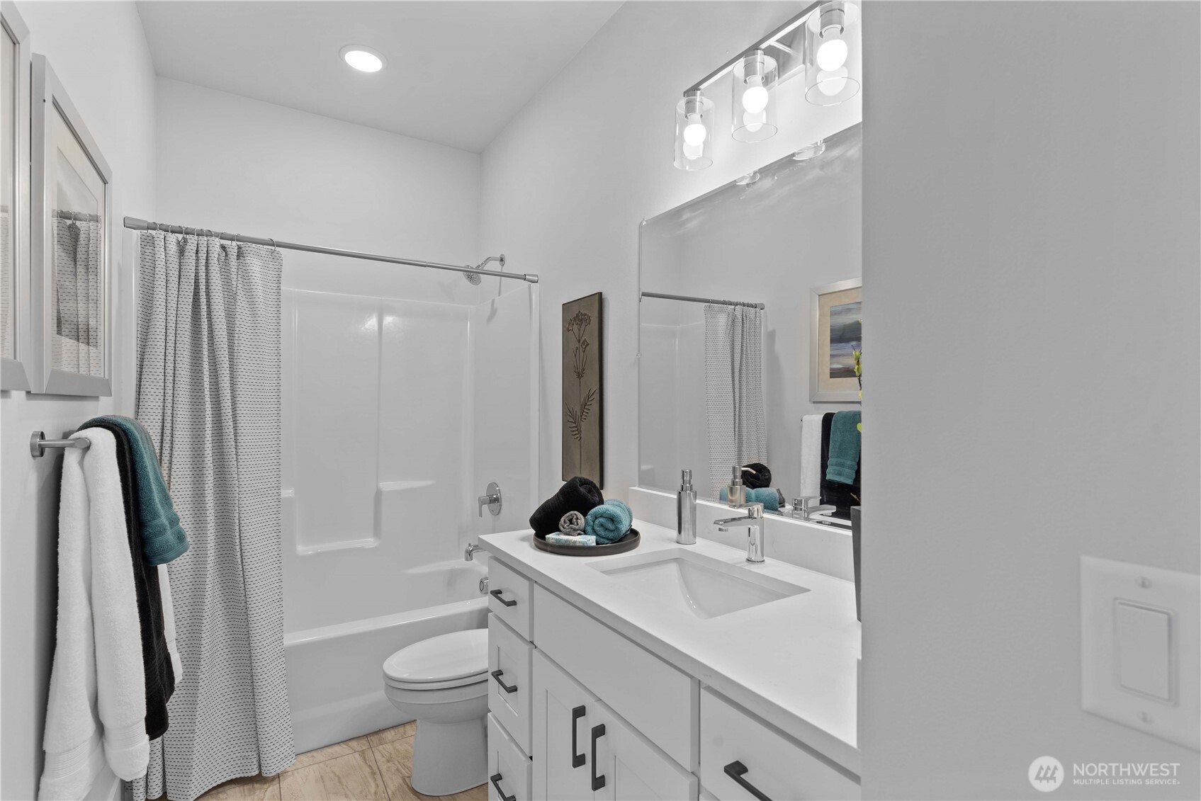 1030 Finch Lane, Unit H1 Wenatchee, WA 98801 - Photo 25 of 30 a bathroom with a sink a toilet a mirror and shower