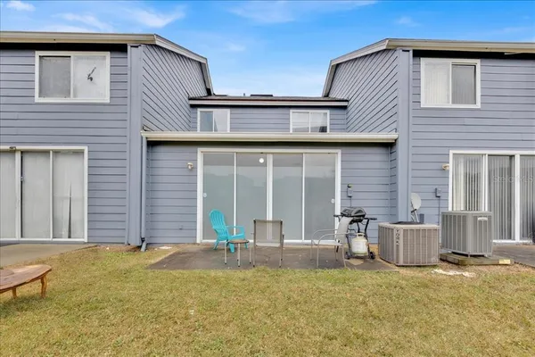a front view of a house with swimming pool in front of house