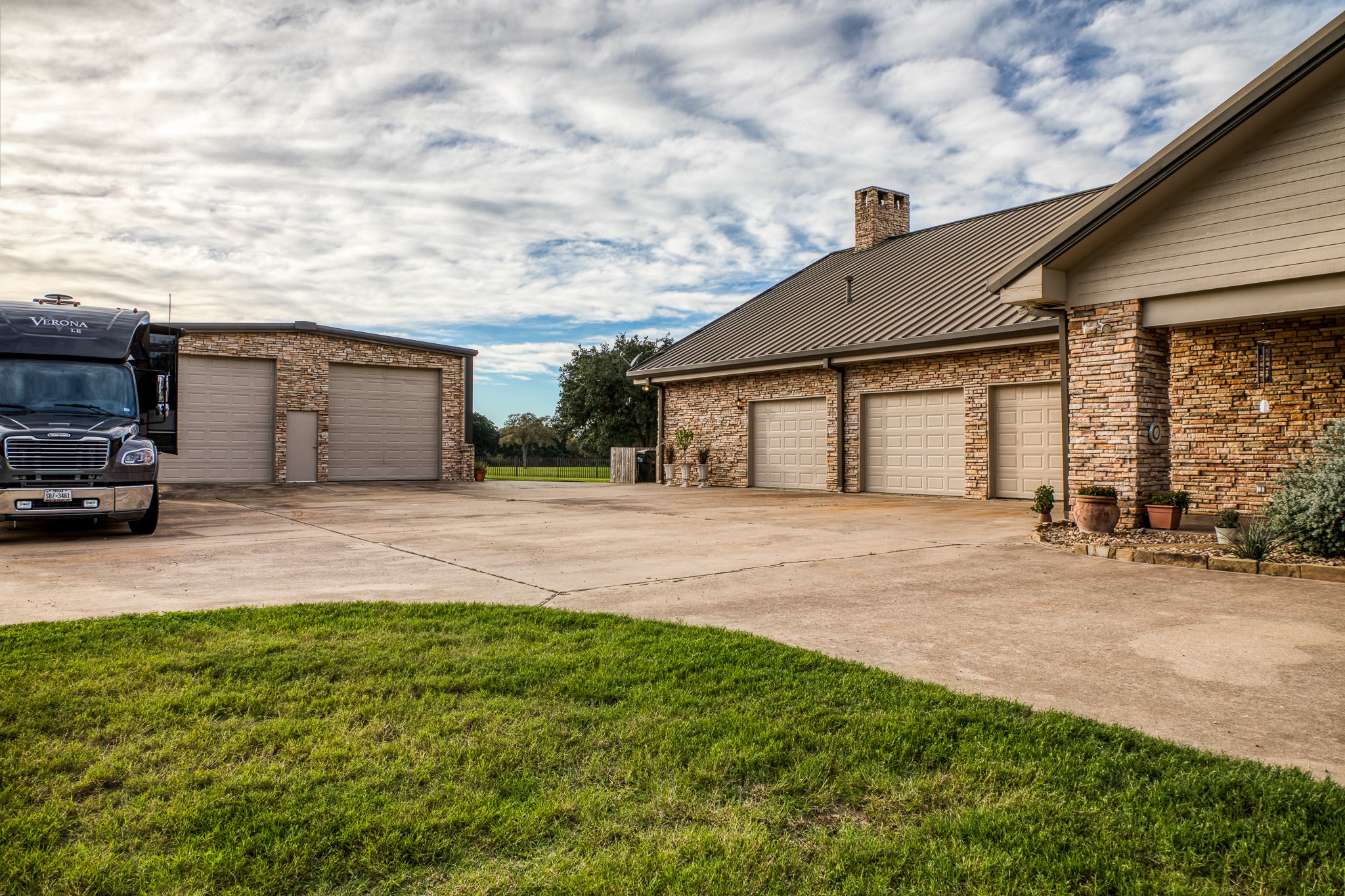 1224 Haines Road Sheridan, TX 77475 - Photo 47 of 49 a front view of a house with a garden and parking space