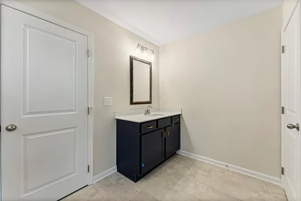 a room that has a sink and a mirror