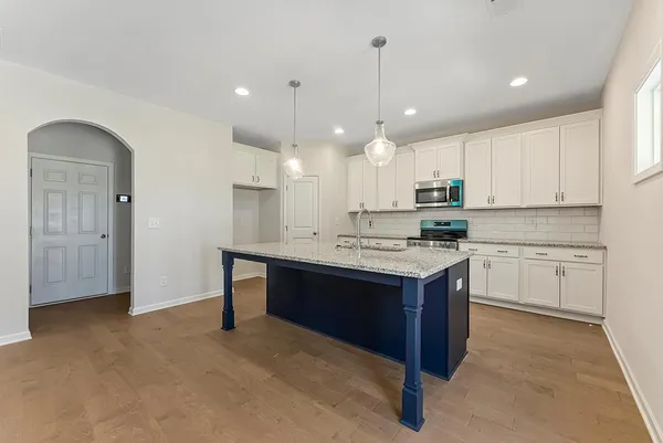 a kitchen with a sink cabinets and window