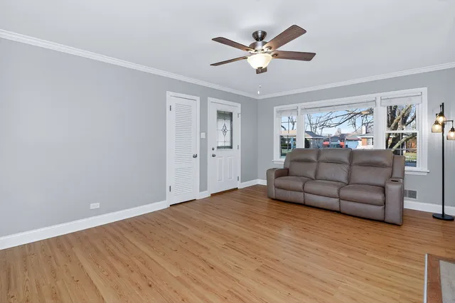a living room with furniture and windows