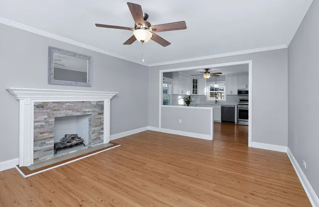 a view of a room with kitchen and fireplace