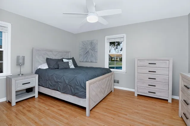 a bedroom with a bed and a dresser