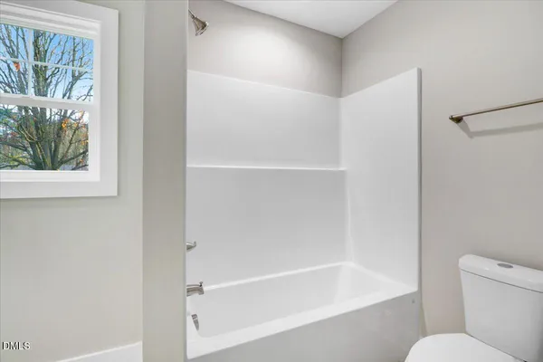 a bathroom with a granite countertop sink mirror and a