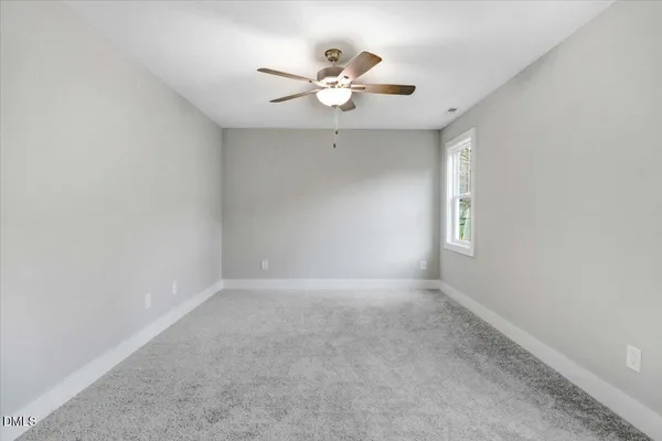 a bathroom with a bathtub and a toilet
