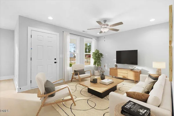a living room with furniture and a flat screen tv