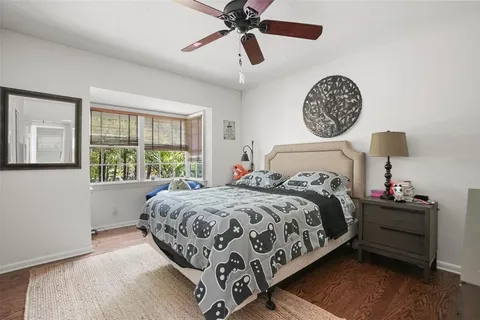 a bedroom with bed and a window