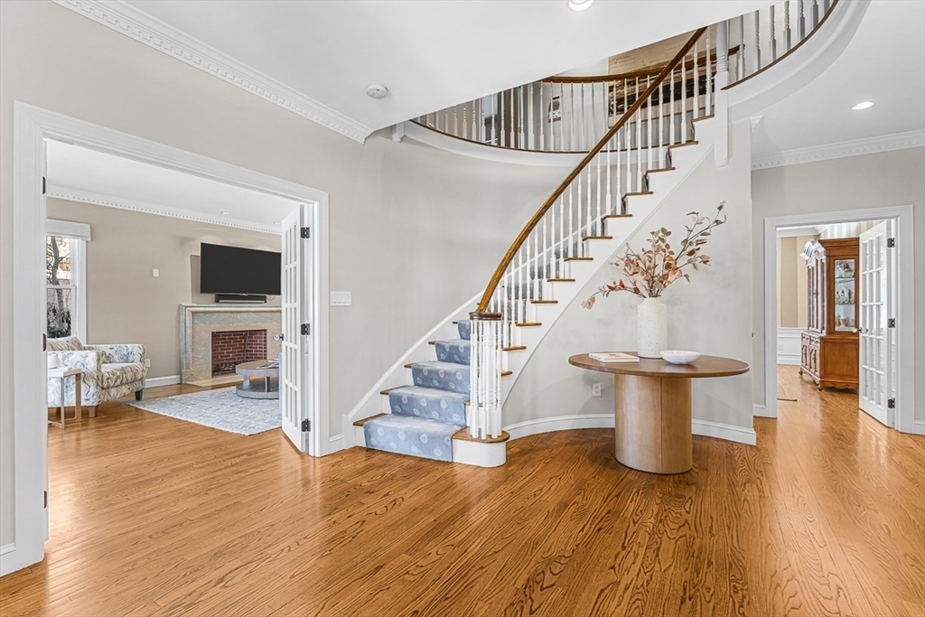 56 Lantern Lane Needham, MA 02492 - Photo 2 of 42 a view of entryway and hall with wooden floor