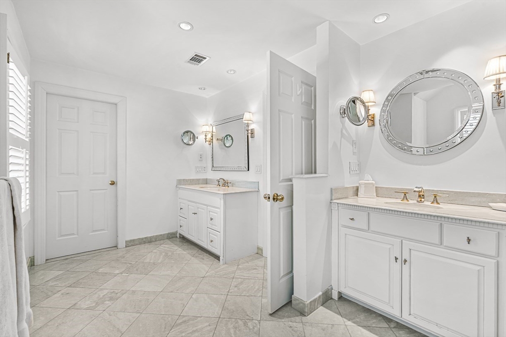 56 Lantern Lane Needham, MA 02492 - Photo 23 of 42 a spacious bathroom with a double vanity sink and a mirror