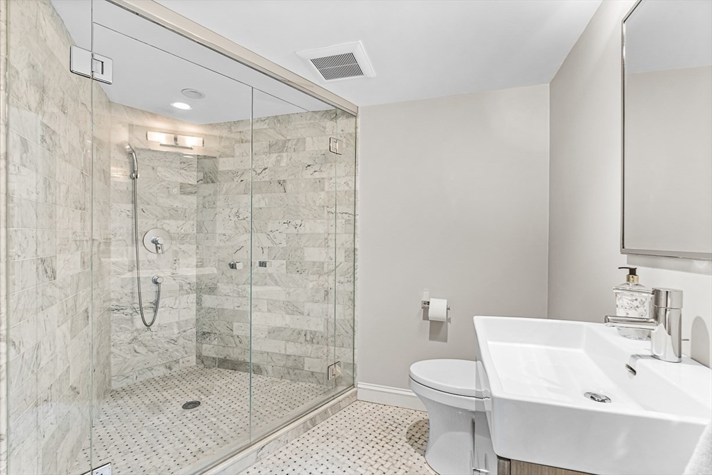 56 Lantern Lane Needham, MA 02492 - Photo 29 of 42 a bathroom with a shower toilet and sink
