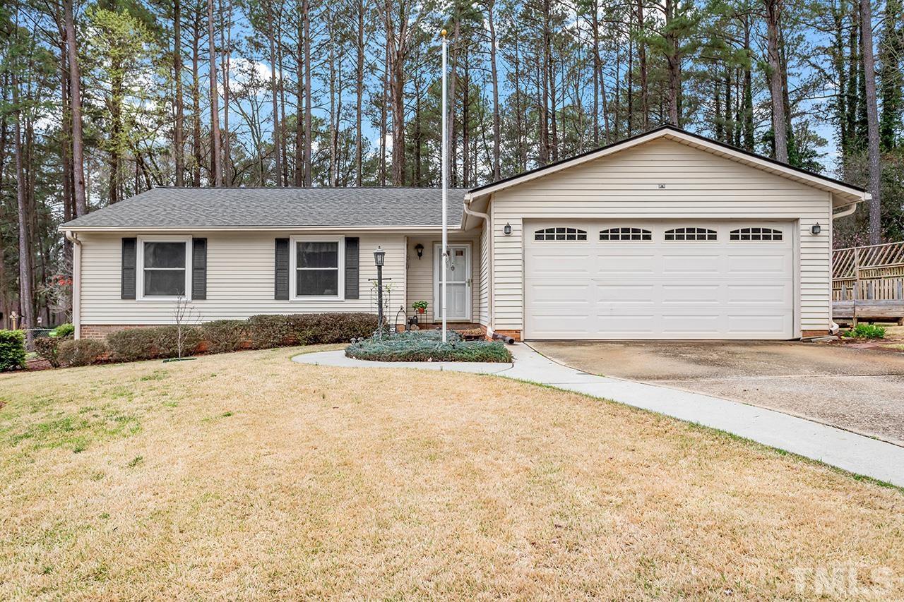 6921 Chamonix Place Raleigh, NC 27613 - Photo 1 of 30 a view of backyard of house