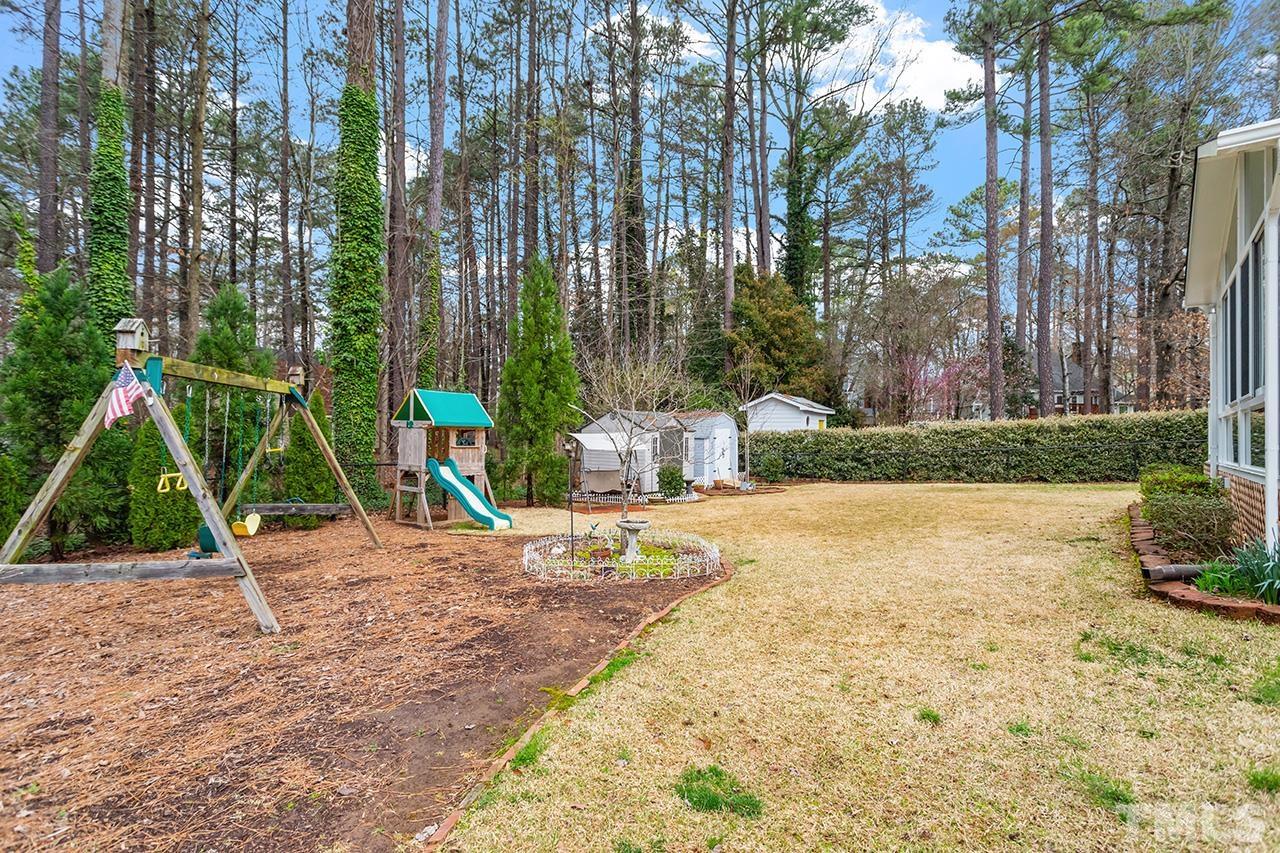 6921 Chamonix Place Raleigh, NC 27613 - Photo 27 of 30 a view of outdoor space with trampoline