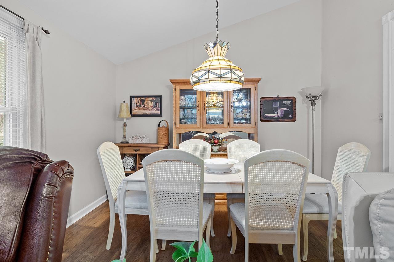 6921 Chamonix Place Raleigh, NC 27613 - Photo 10 of 30 a view of a dining room with furniture
