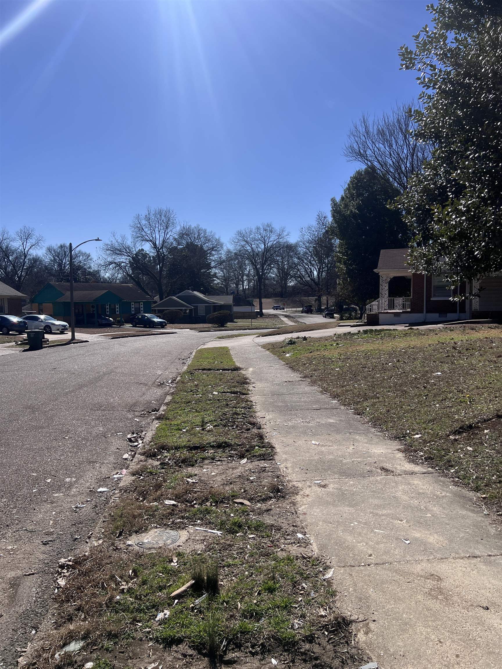 1297 Aubra Road Memphis, TN 38111 - Photo 38 of 38 View of asphalt road featuring sidewalks, street lighting, and a residential view