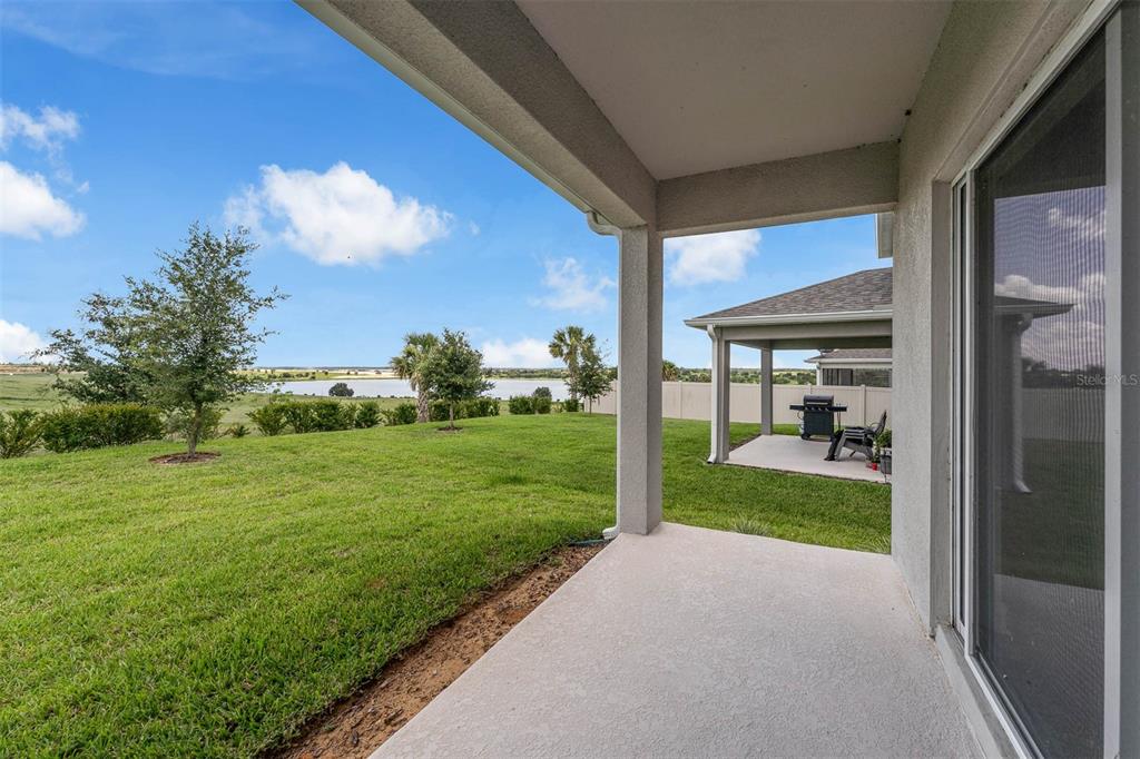 7367 Catania Loop Clermont, FL 34714 - Photo 16 of 58 a view of a porch and garden