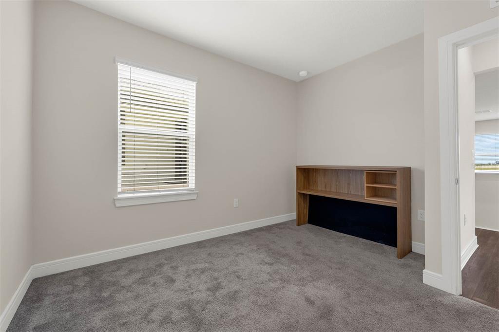 7367 Catania Loop Clermont, FL 34714 - Photo 23 of 58 a view of an empty room with a window