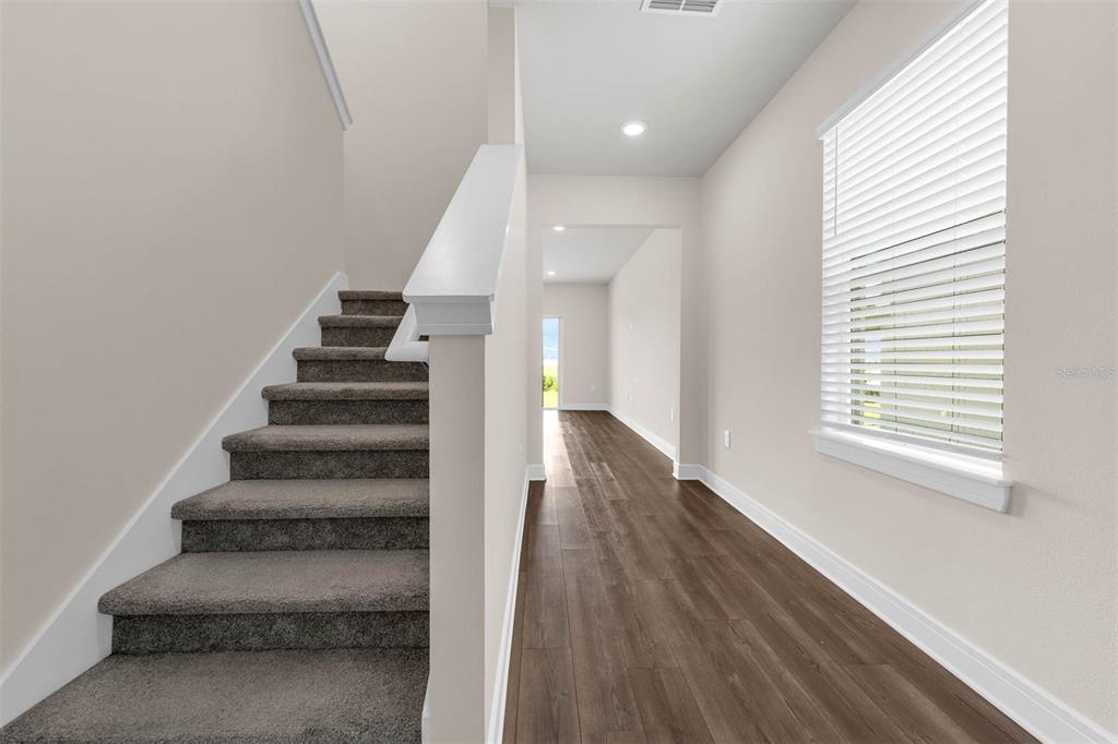 7367 Catania Loop Clermont, FL 34714 - Photo 25 of 58 a view of entryway and hall with wooden floor