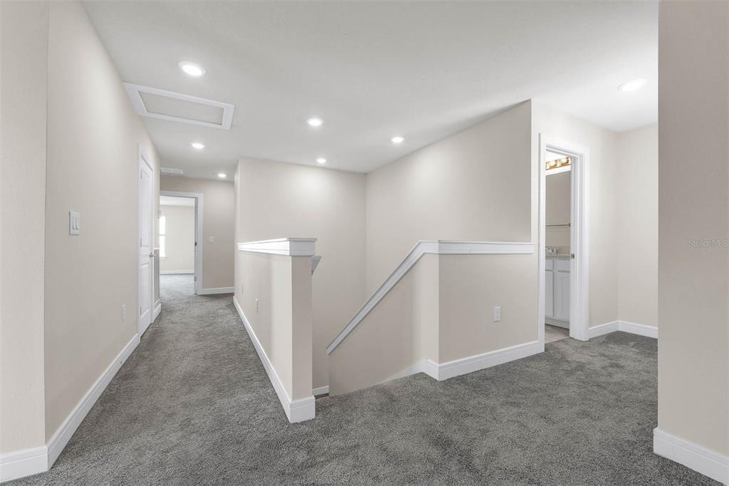 7367 Catania Loop Clermont, FL 34714 - Photo 26 of 58 a view of a hallway with staircase