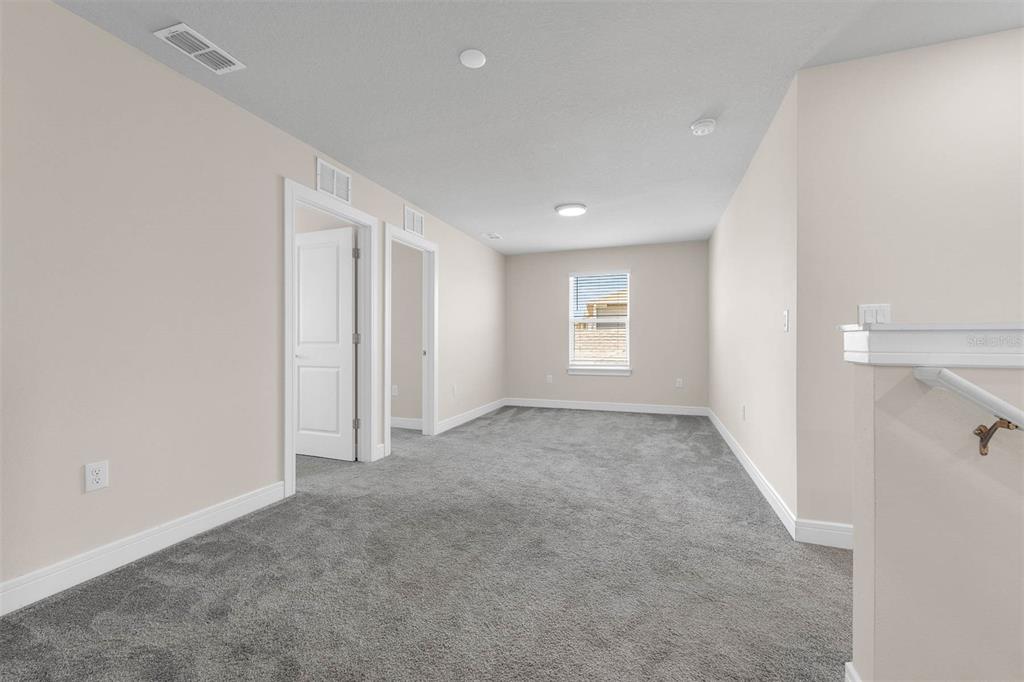 7367 Catania Loop Clermont, FL 34714 - Photo 27 of 58 an empty room with windows