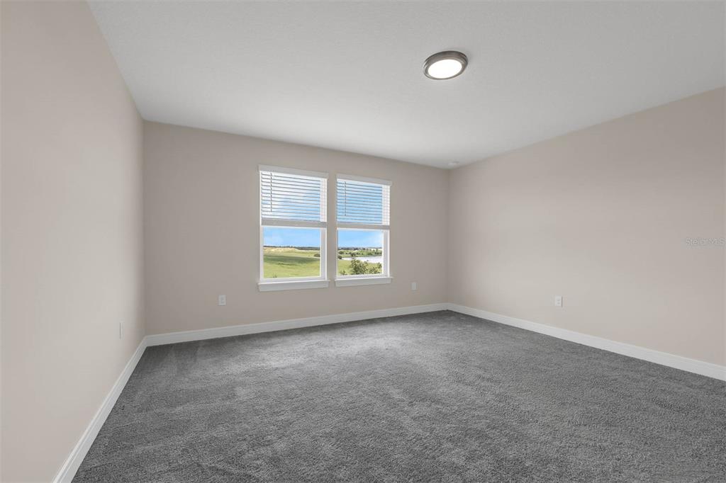 7367 Catania Loop Clermont, FL 34714 - Photo 31 of 58 an empty room with windows