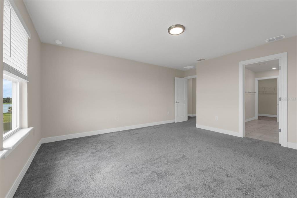 7367 Catania Loop Clermont, FL 34714 - Photo 33 of 58 an empty room with windows