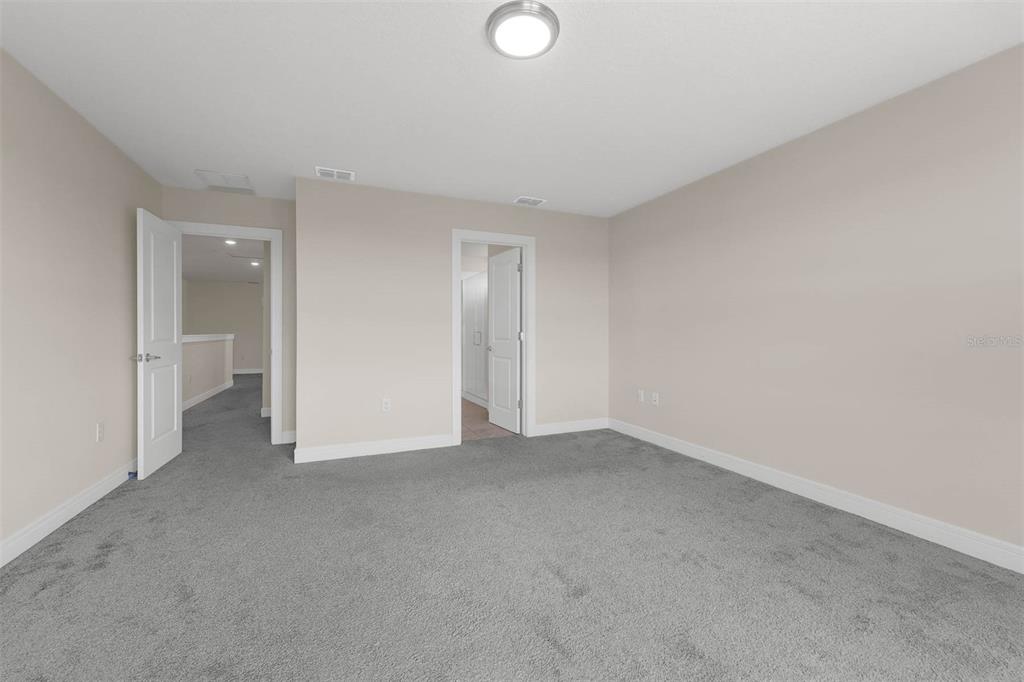 7367 Catania Loop Clermont, FL 34714 - Photo 34 of 58 a view of an empty room and fire place