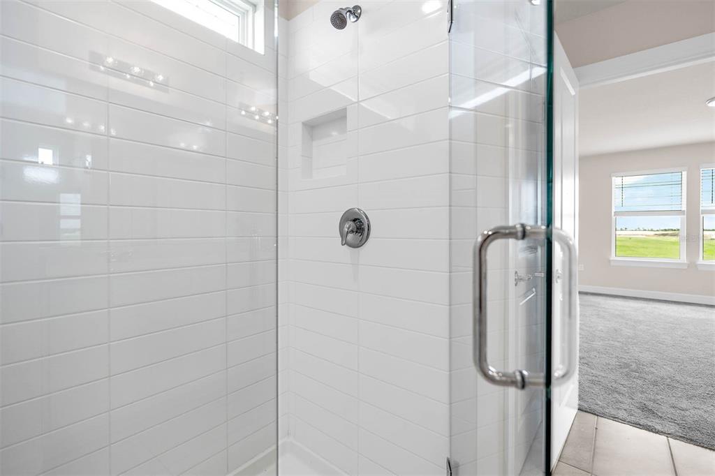 7367 Catania Loop Clermont, FL 34714 - Photo 37 of 58 a bathroom with a shower