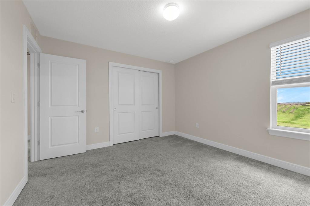 7367 Catania Loop Clermont, FL 34714 - Photo 41 of 58 a view of an empty room with a window