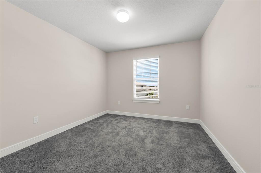 7367 Catania Loop Clermont, FL 34714 - Photo 42 of 58 an empty room with windows