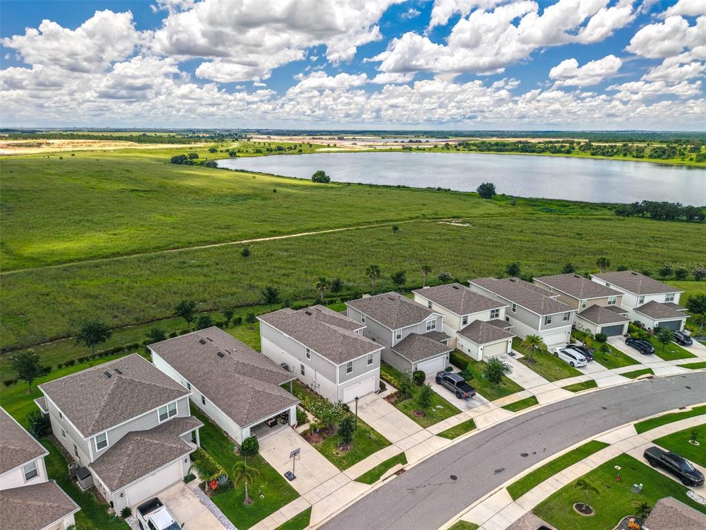 7367 Catania Loop Clermont, FL 34714 - Photo 50 of 58 an aerial view of a house with a garden