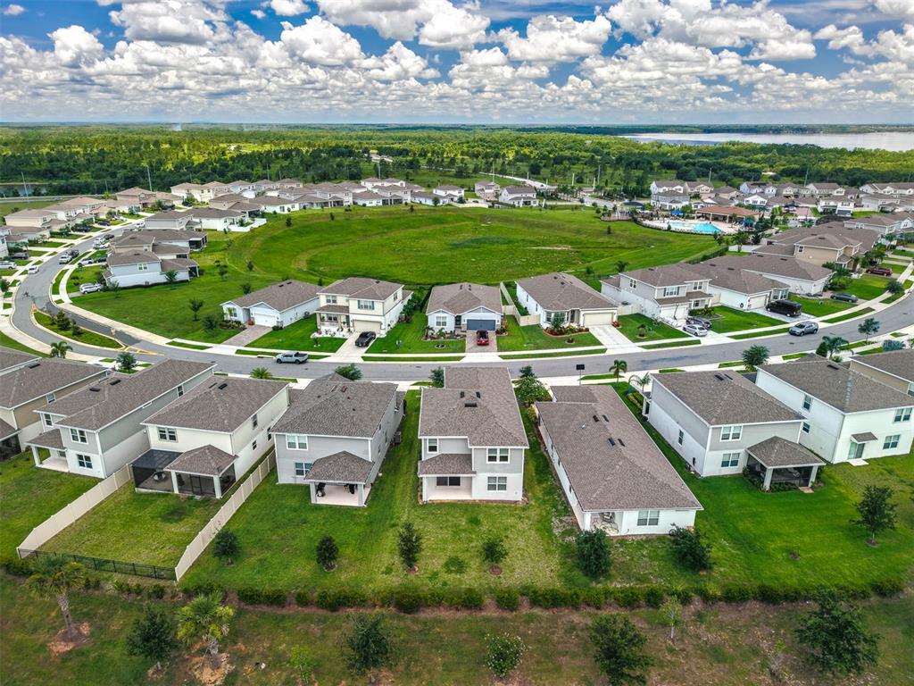 7367 Catania Loop Clermont, FL 34714 - Photo 52 of 58 an aerial view of a house with a garden