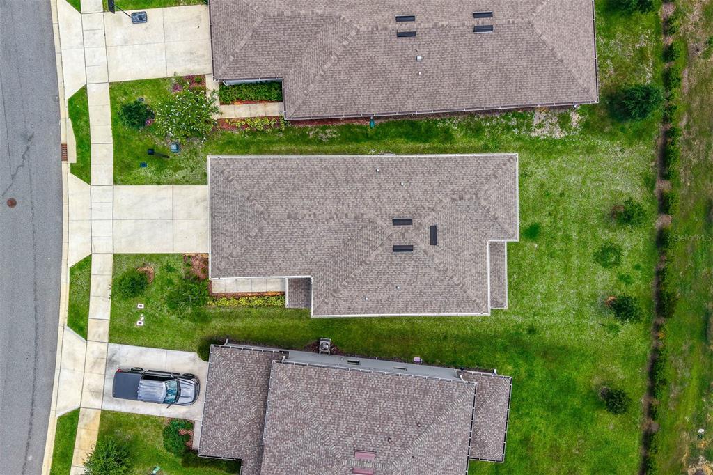 7367 Catania Loop Clermont, FL 34714 - Photo 55 of 58 an aerial view of a house with a yard