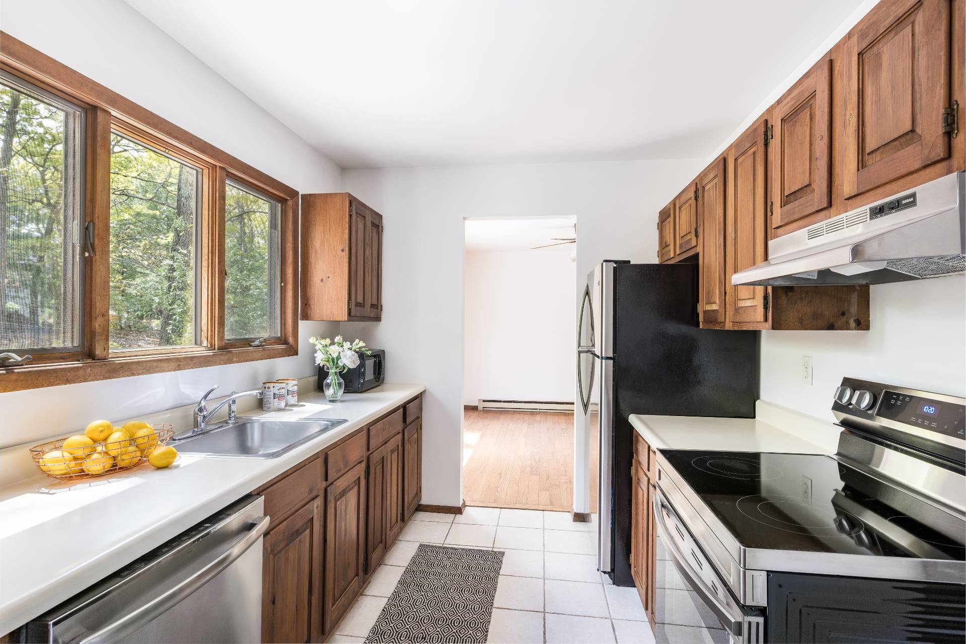 3564 Noyack Road Sag Harbor, NY 11963 - Photo 4 of 10 a kitchen with granite countertop a sink and refrigerator