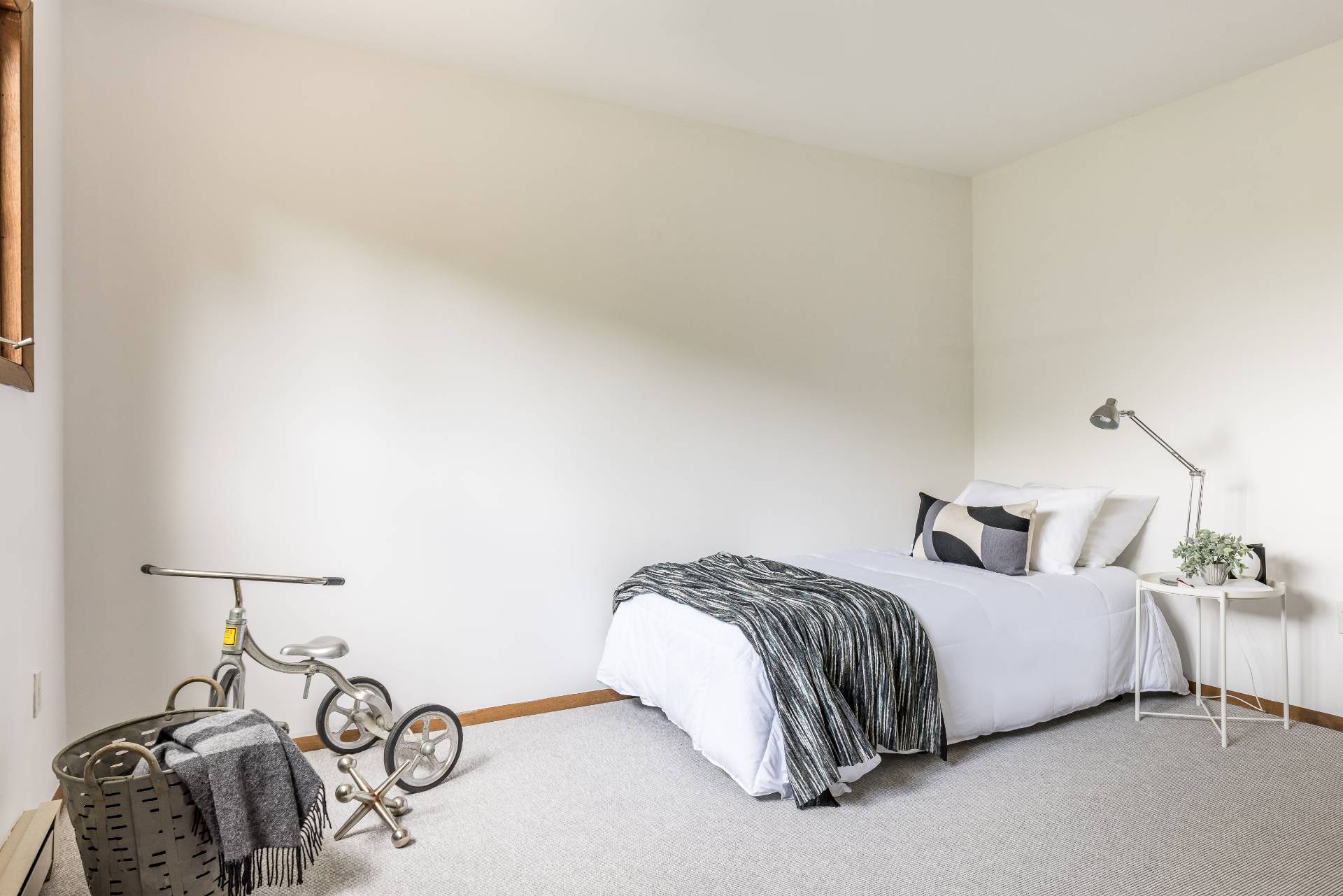 3564 Noyack Road Sag Harbor, NY 11963 - Photo 7 of 10 a bedroom with a bed and a lamp