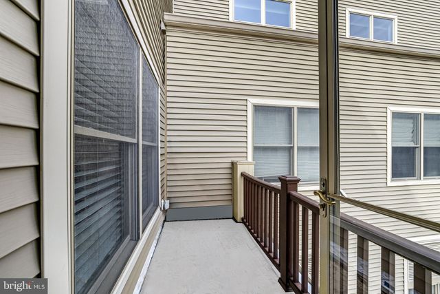 a view of a building with sitting area