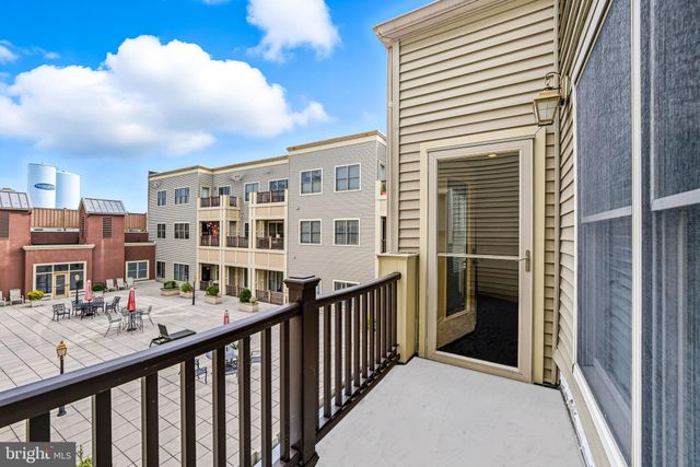 a front view of a building and outdoor seating