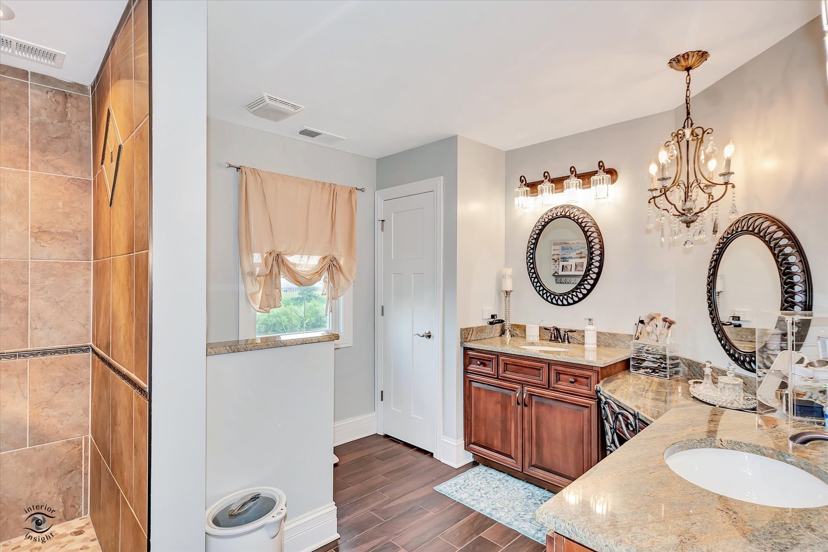 23933 Roberts Street Manhattan, IL 60442 - Photo 12 of 26 a living room with wooden floor and a chandelier