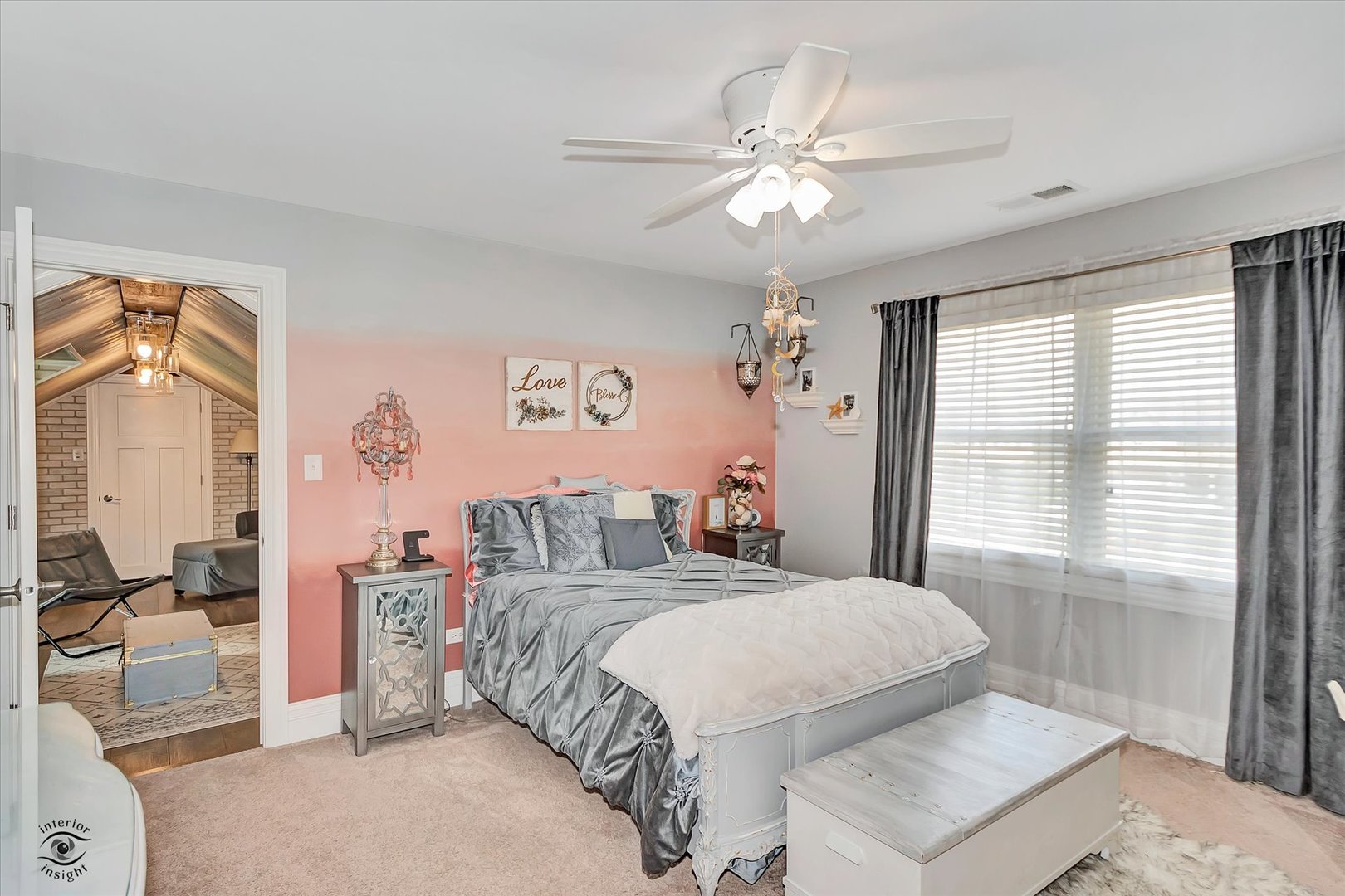 23933 Roberts Street Manhattan, IL 60442 - Photo 13 of 26 a bedroom with a large bed and a chandelier