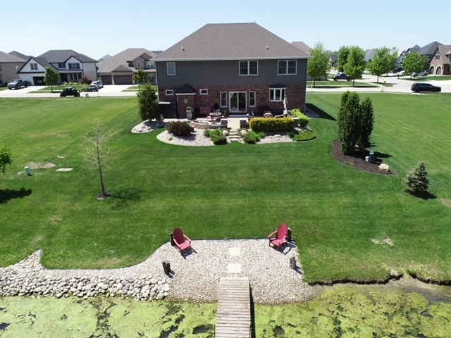 23933 Roberts Street Manhattan, IL 60442 - Photo 21 of 26 a front view of a house with garden