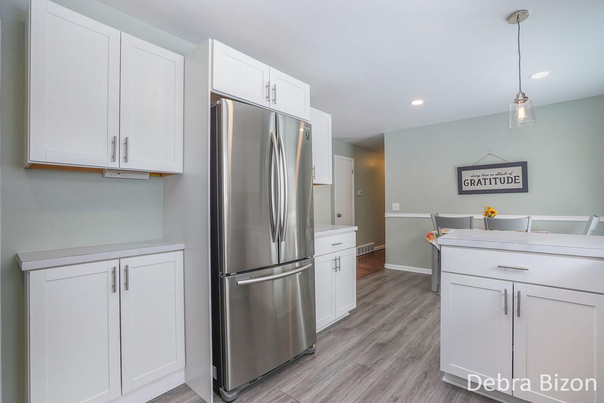 1114 Woodside Road Muskegon, MI 49441 - Photo 7 of 26 1114 Woodside kitchen stove to dining