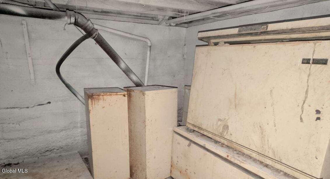 273 Whitney Street Moriah, NY 12974 - Photo 27 of 30 basement stuff old freezer