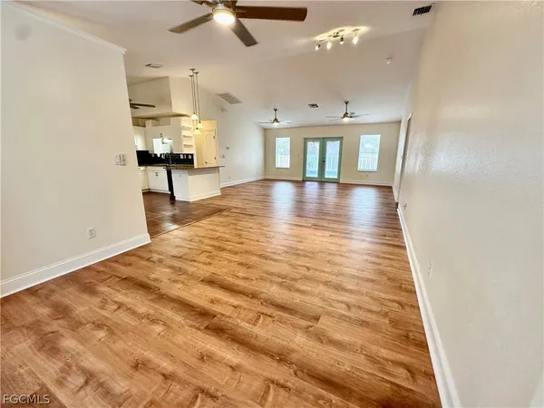 a kitchen with stainless steel appliances a stove a refrigerator and cabinets