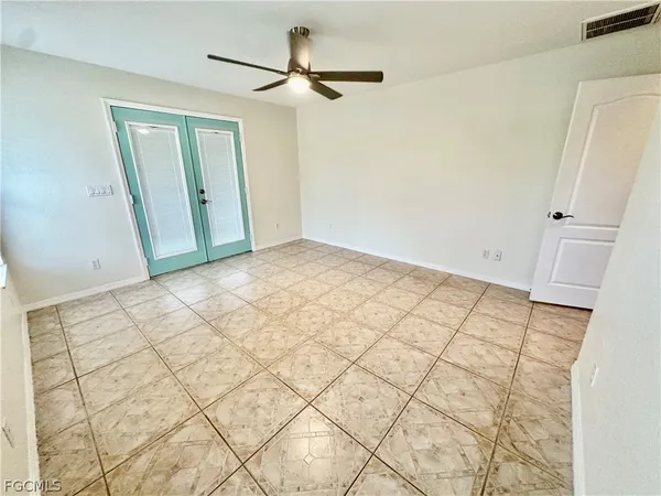 a spacious bathroom with a granite countertop sink toilet and shower