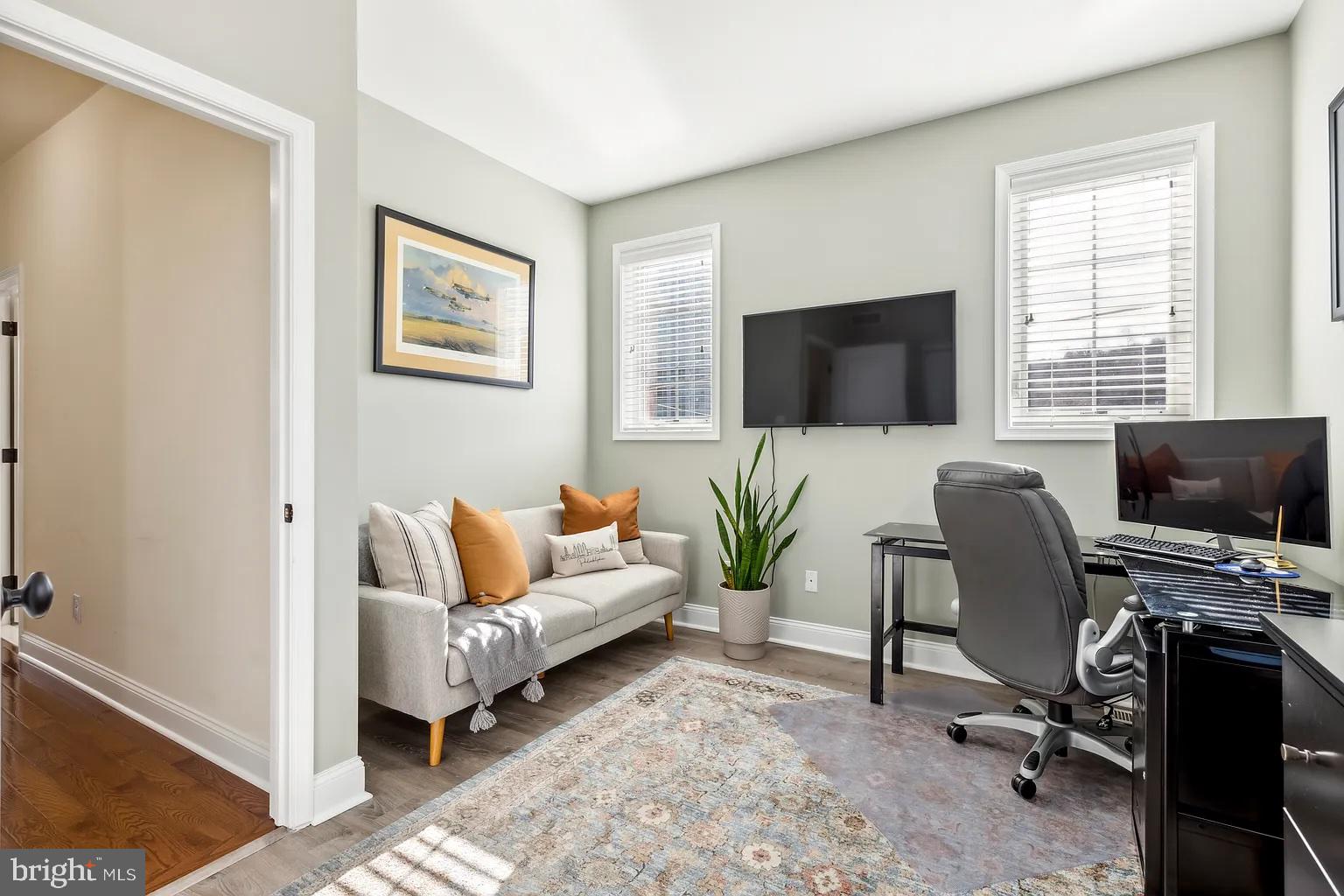 103 Front Street Conshohocken, PA 19428 - Photo 12 of 34 a living room with furniture and a flat screen tv