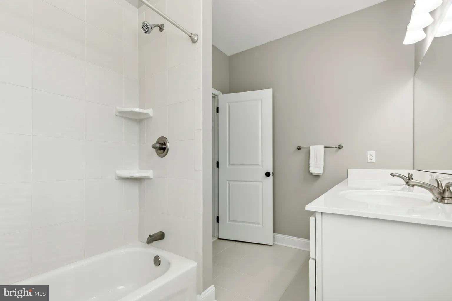 103 Front Street Conshohocken, PA 19428 - Photo 15 of 34 a bathroom with a sink a mirror and a bathtub