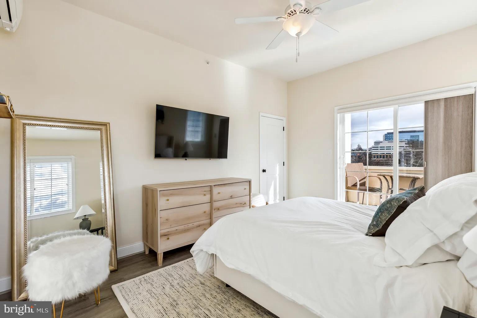 103 Front Street Conshohocken, PA 19428 - Photo 21 of 34 a bedroom with a bed and a flat screen tv