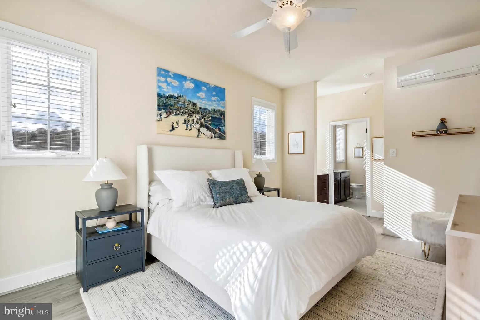 103 Front Street Conshohocken, PA 19428 - Photo 22 of 34 a bedroom with a bed and a chandelier